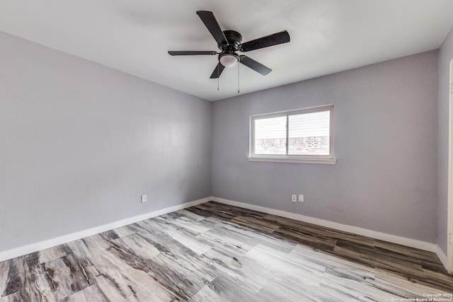 empty room with ceiling fan and light wood-type flooring