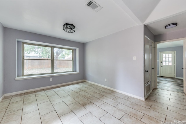 empty room with light tile patterned floors