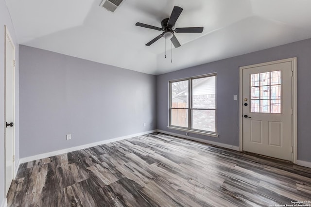 interior space with plenty of natural light, hardwood / wood-style flooring, vaulted ceiling, and ceiling fan