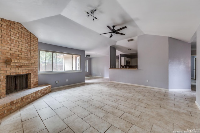 unfurnished living room featuring a brick fireplace, light tile patterned floors, ceiling fan, and vaulted ceiling