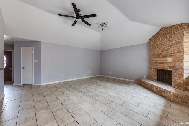 unfurnished living room featuring a brick fireplace, light tile patterned floors, lofted ceiling, and ceiling fan