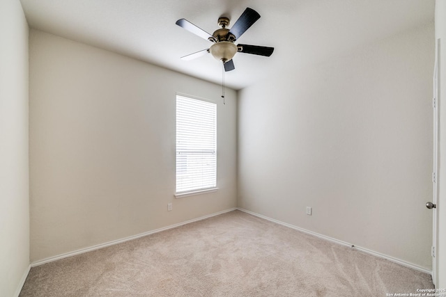 unfurnished room with ceiling fan and light colored carpet