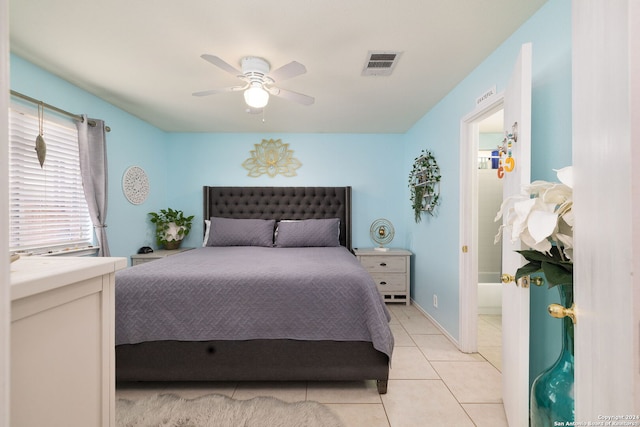 tiled bedroom featuring ceiling fan