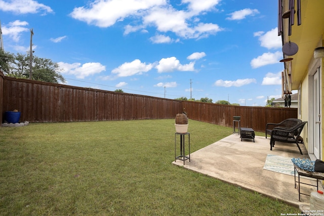 view of yard featuring a fire pit and a patio