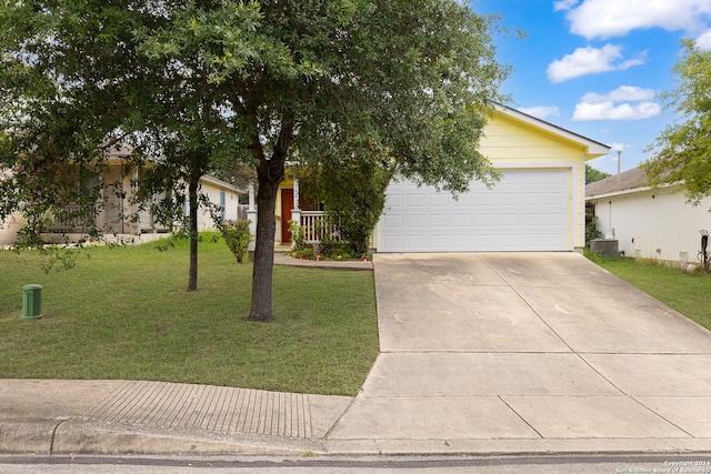 view of front of property with a garage and a front yard