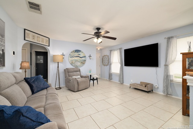 living room featuring light tile patterned flooring and ceiling fan