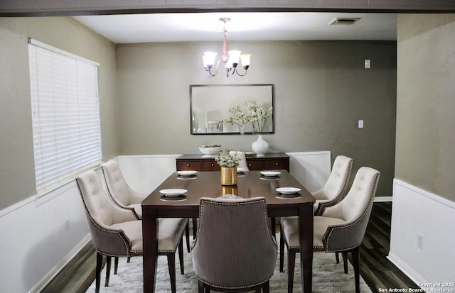 dining room with a chandelier, hardwood / wood-style floors, and plenty of natural light