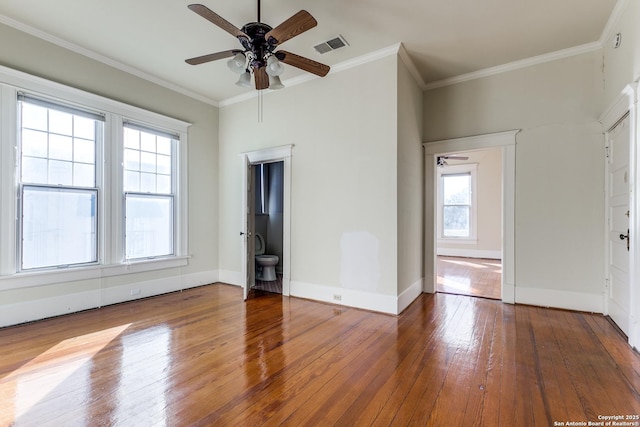 interior space with crown molding, hardwood / wood-style floors, and ceiling fan