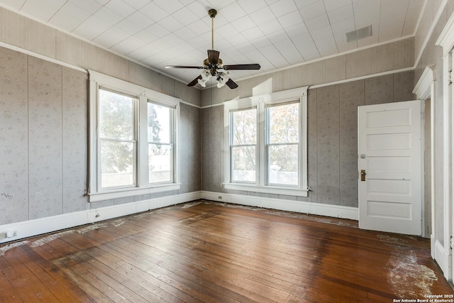 unfurnished room with dark hardwood / wood-style floors, ceiling fan, and ornamental molding