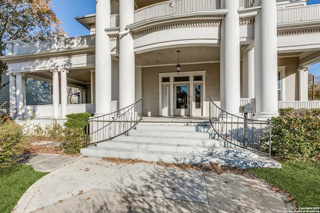 view of exterior entry featuring a porch