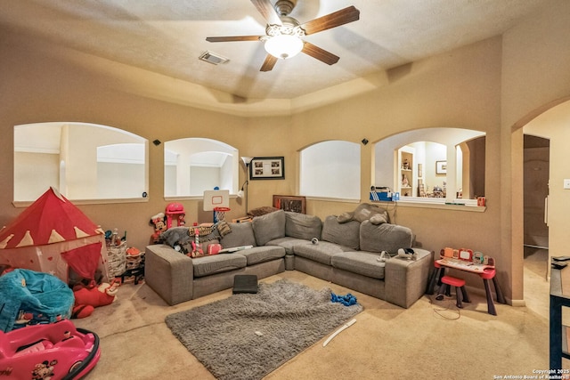 living room featuring ceiling fan and light carpet