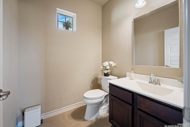 bathroom featuring vanity, toilet, and tile patterned flooring