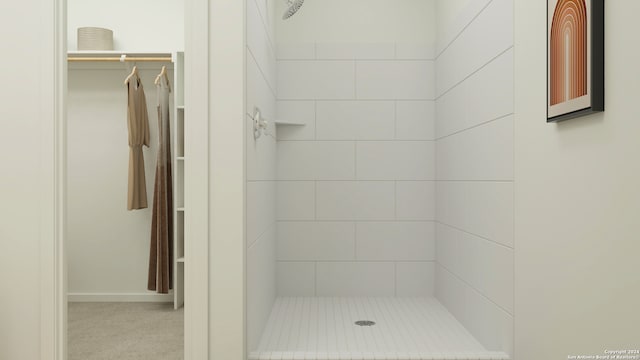 bathroom with a tile shower