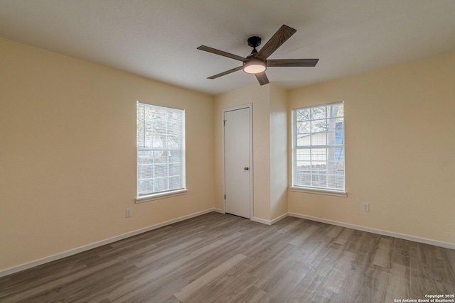 unfurnished bedroom with light hardwood / wood-style floors, a closet, and ceiling fan