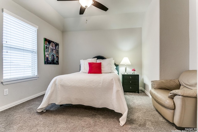 bedroom featuring multiple windows, carpet flooring, and ceiling fan