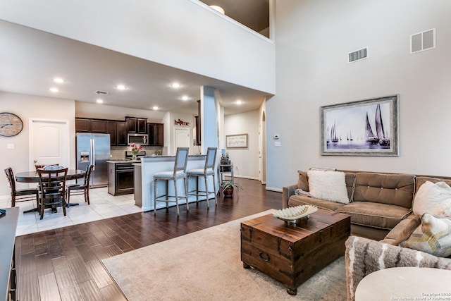 living room with a towering ceiling