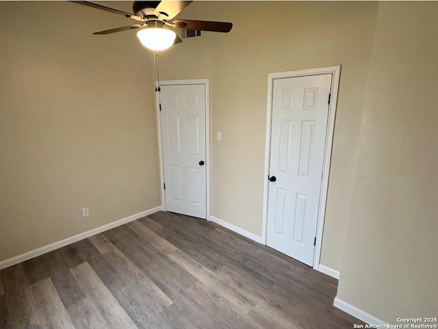 unfurnished bedroom with ceiling fan and hardwood / wood-style floors