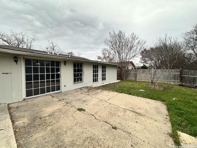 exterior space featuring a patio and a lawn