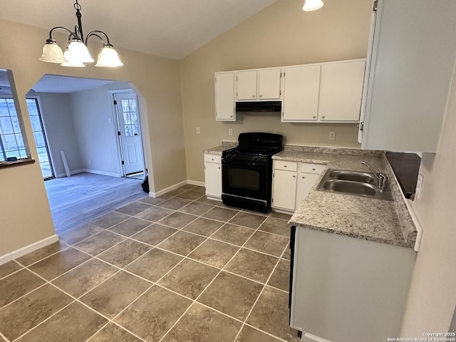 kitchen featuring pendant lighting, white cabinetry, sink, dark tile patterned floors, and black gas stove