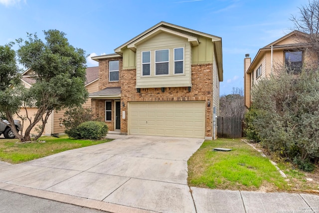 view of front of house with a front yard and a garage