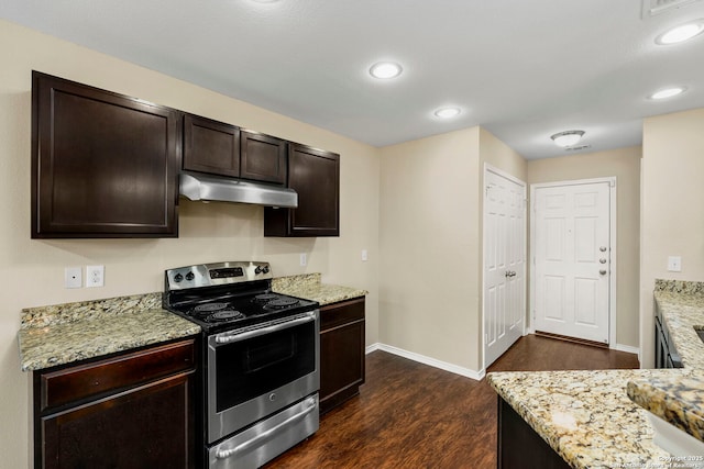 kitchen with dark brown cabinets, dark hardwood / wood-style floors, stainless steel range with electric stovetop, and light stone countertops