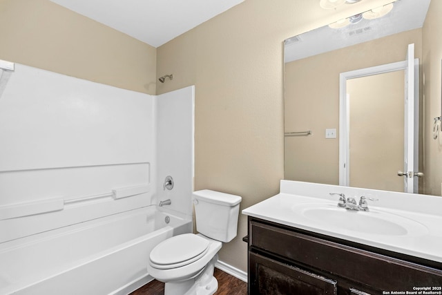 full bathroom with wood-type flooring, shower / bathing tub combination, vanity, and toilet