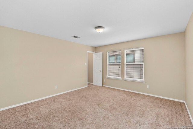 unfurnished room with carpet