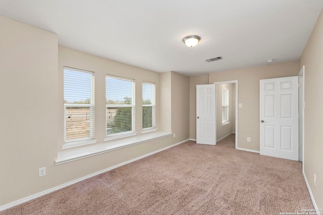 unfurnished room with carpet flooring