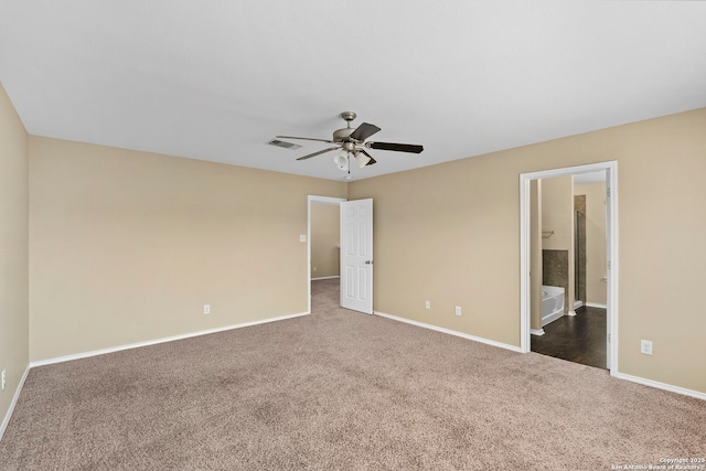 unfurnished room with ceiling fan and dark colored carpet