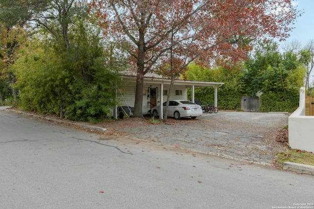 view of front of home with a carport