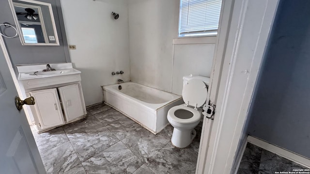 bathroom with toilet and vanity