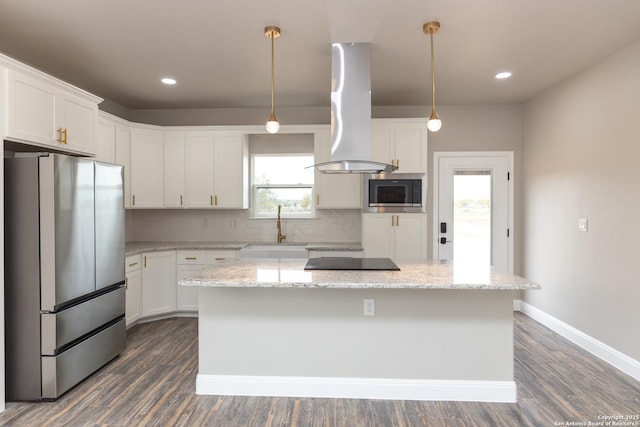 kitchen with a center island, light stone countertops, appliances with stainless steel finishes, island range hood, and sink