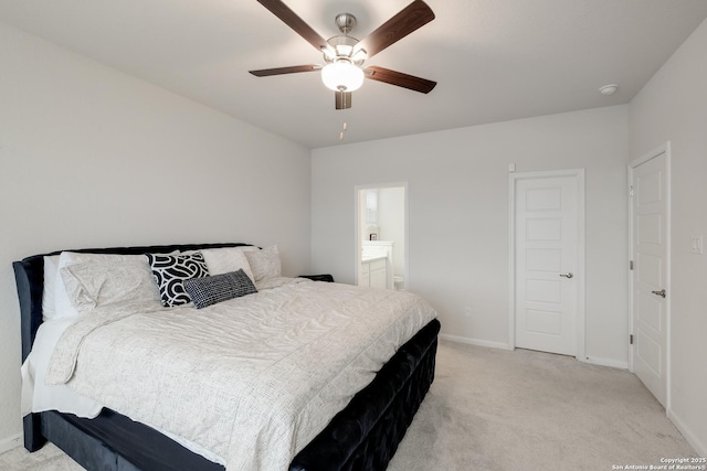 carpeted bedroom with connected bathroom and ceiling fan