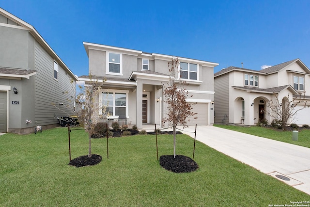 view of front of property featuring a garage and a front lawn