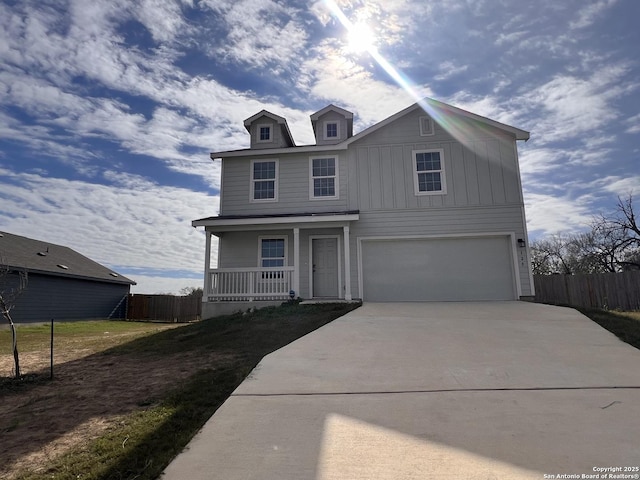 view of front of house with a garage and covered porch