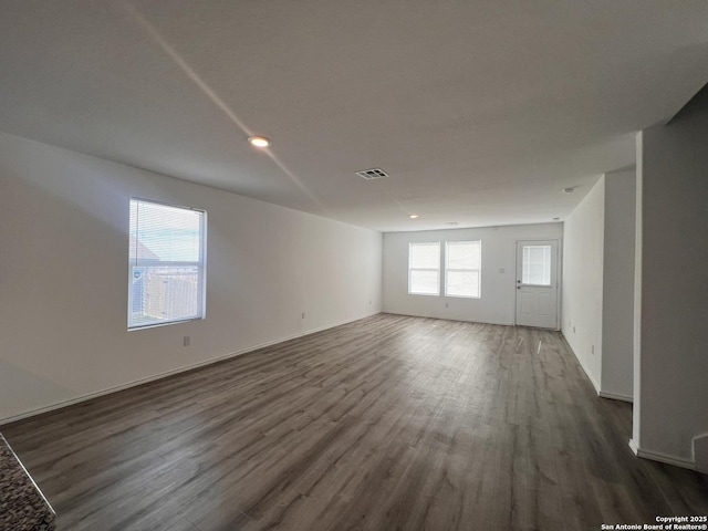 empty room with dark hardwood / wood-style floors