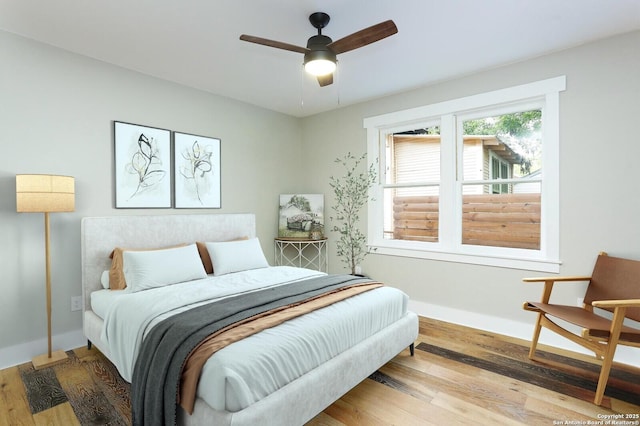 bedroom featuring light wood-type flooring and ceiling fan