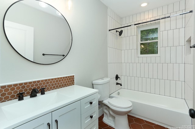 full bathroom with toilet, tile patterned flooring, vanity, backsplash, and tiled shower / bath