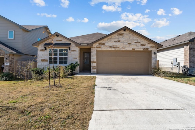 view of front of house with a garage and a front yard