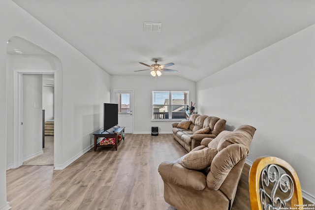 living room with light wood-type flooring, vaulted ceiling, and ceiling fan