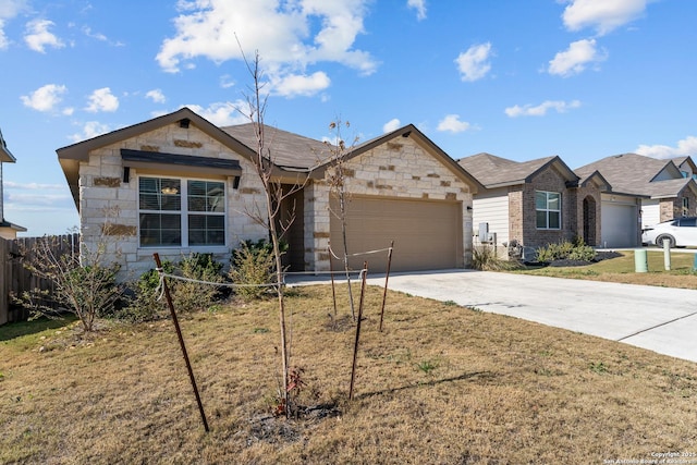 single story home featuring a garage and a front lawn