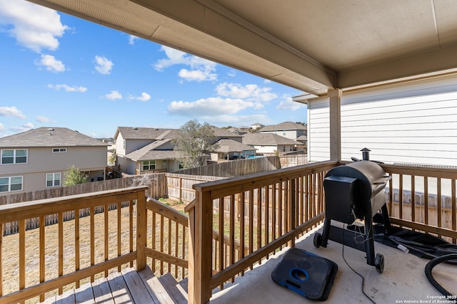 wooden terrace featuring a grill