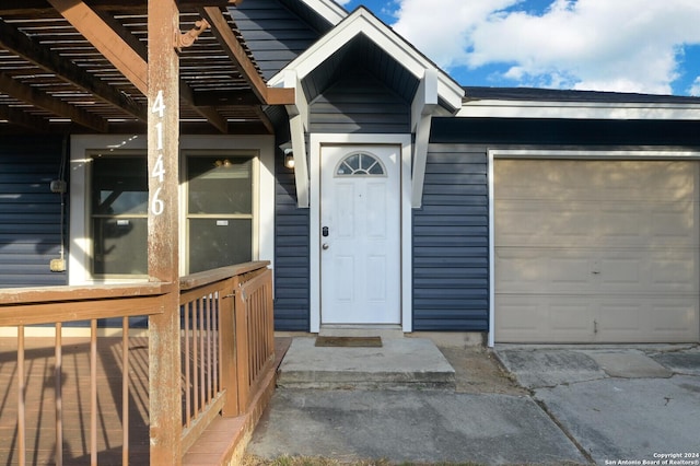 entrance to property featuring a garage