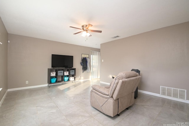 living room featuring ceiling fan