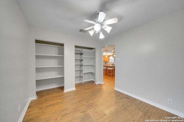 interior space with light hardwood / wood-style floors and ceiling fan