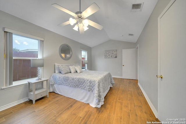 bedroom featuring light wood-type flooring, ceiling fan, and lofted ceiling