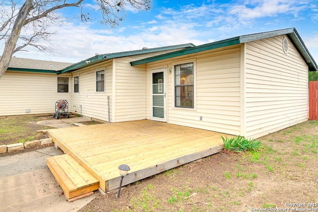 back of house featuring a patio area and a deck