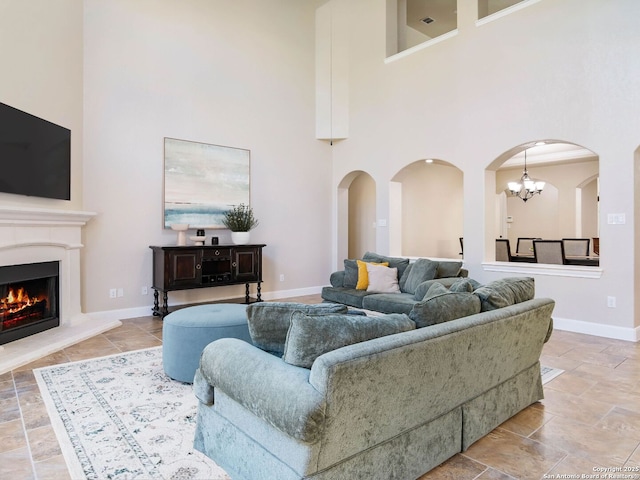 living room featuring a towering ceiling