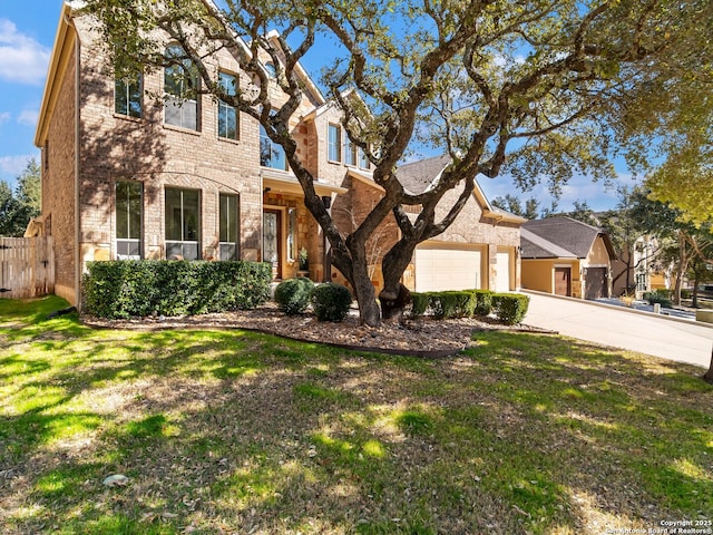 view of front of property featuring a garage and a front yard