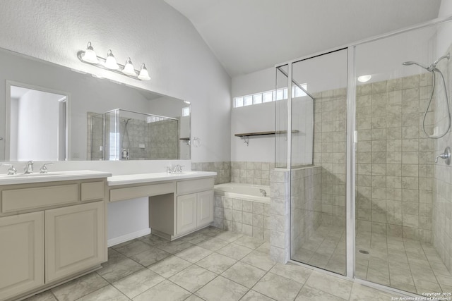 bathroom with independent shower and bath, vaulted ceiling, tile patterned floors, and vanity